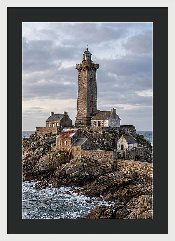 Lighthouse On Rocky Shoreline