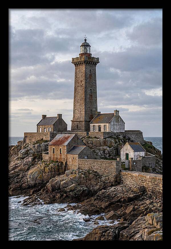 Lighthouse On Rocky Shoreline