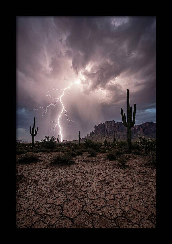 Lightning Strikes Over Desert Landscape
