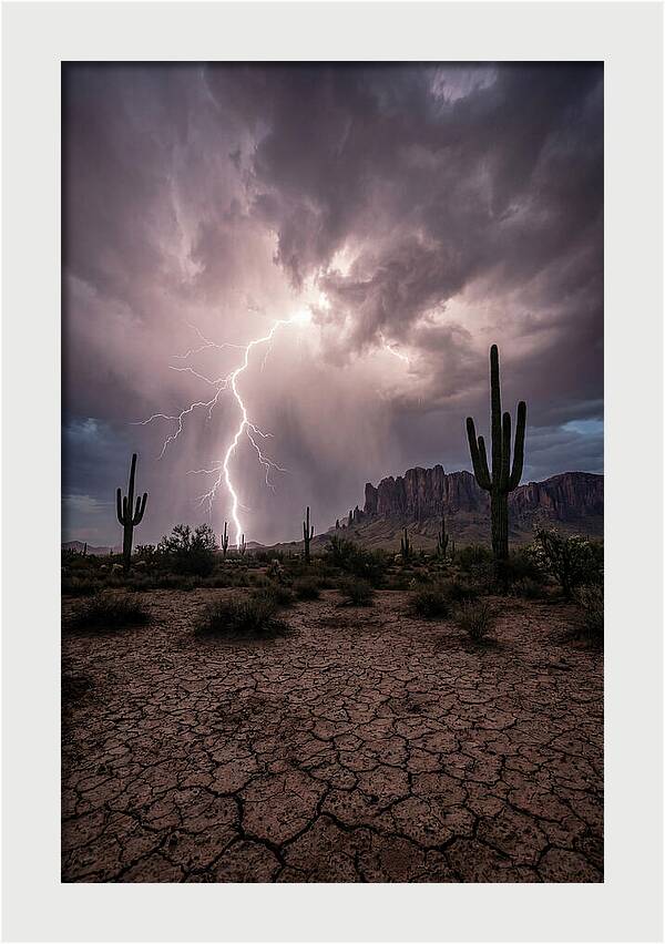 Lightning Strikes Over Desert Landscape