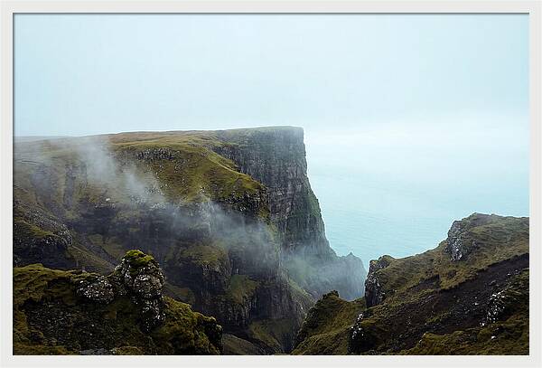 Majestic Cliff Overlooking Serene Lake