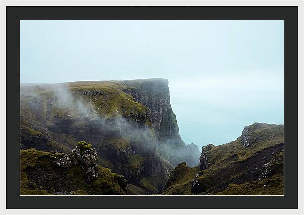 Majestic Cliff Overlooking Serene Lake