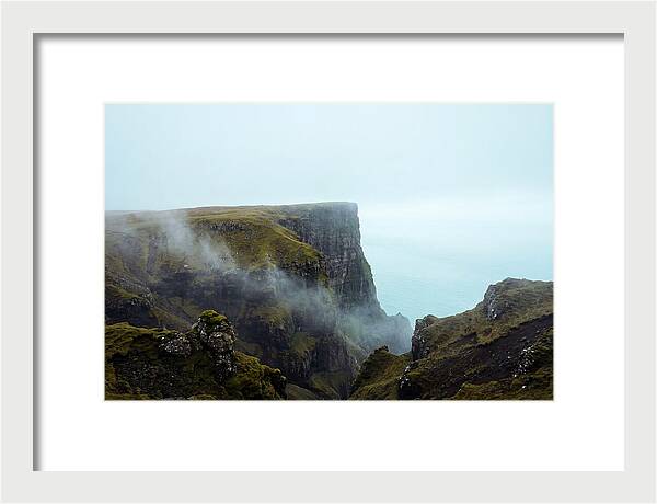 Majestic Cliff Overlooking Serene Lake