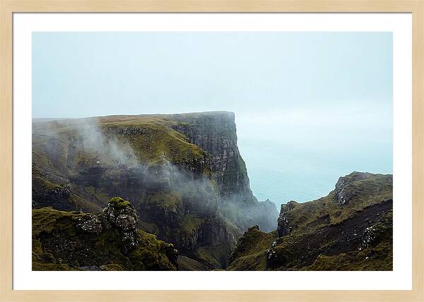 Majestic Cliff Overlooking Serene Lake