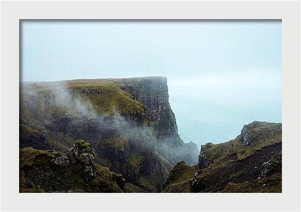 Majestic Cliff Overlooking Serene Lake