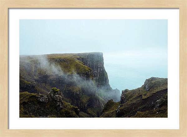 Majestic Cliff Overlooking Serene Lake