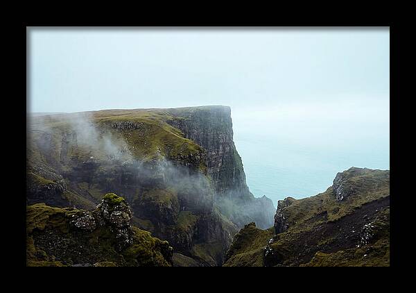 Majestic Cliff Overlooking Serene Lake