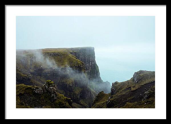 Majestic Cliff Overlooking Serene Lake