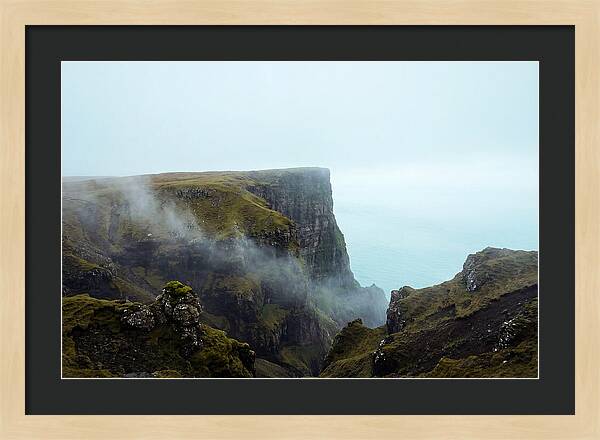 Majestic Cliff Overlooking Serene Lake