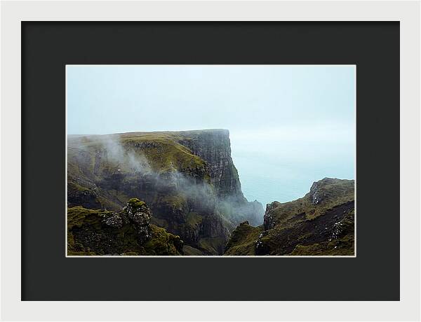 Majestic Cliff Overlooking Serene Lake