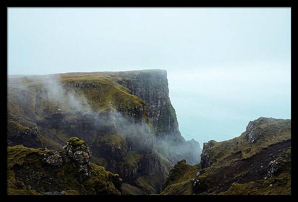 Majestic Cliff Overlooking Serene Lake