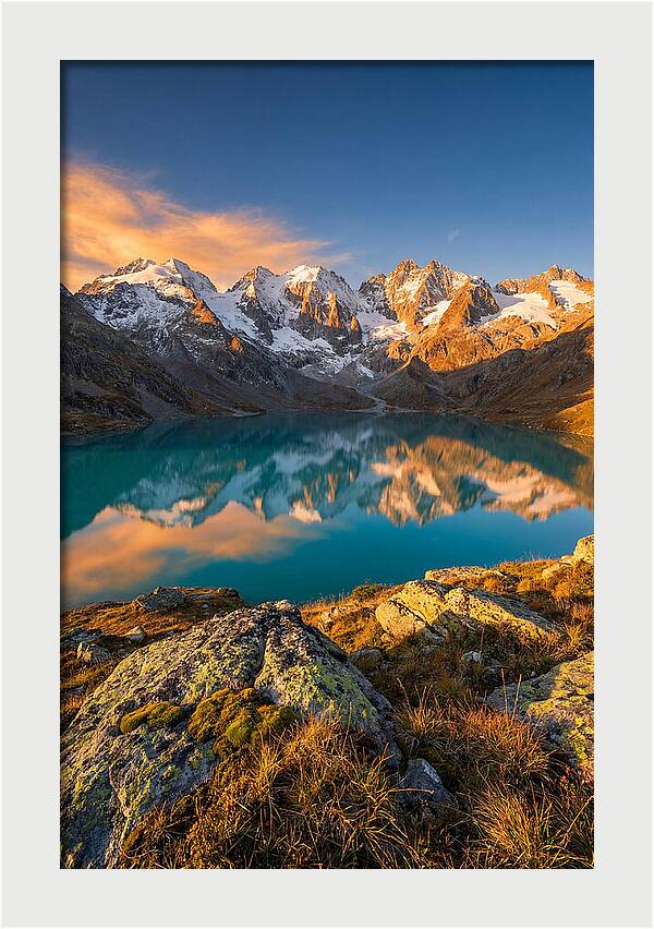 Majestic Peaks Reflected In Tranquil Waters