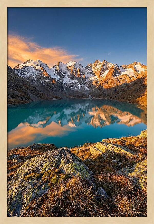 Majestic Peaks Reflected In Tranquil Waters