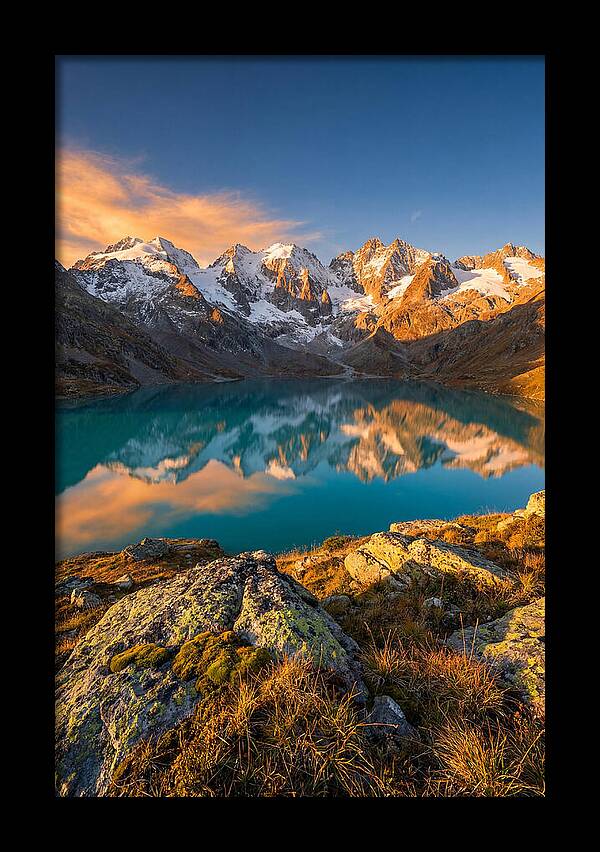 Majestic Peaks Reflected In Tranquil Waters