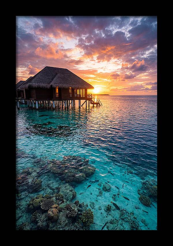 Maldivian Overwater Bungalow At Dusk