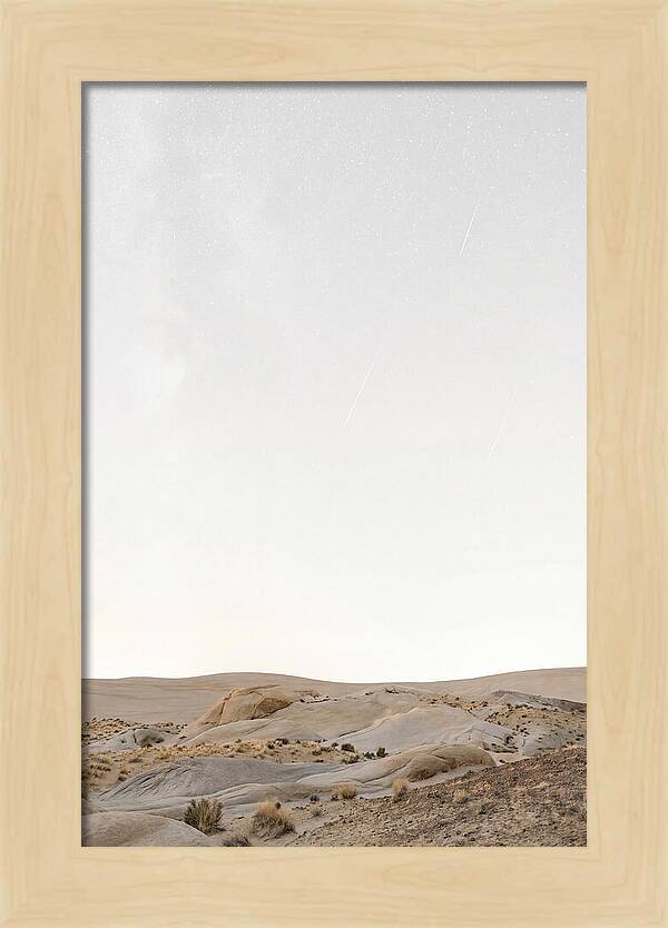 Meteor Shower Over Desert Landscape