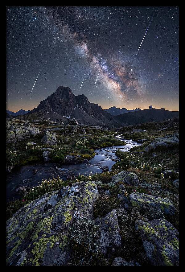 Meteor Shower Over Majestic Mountains