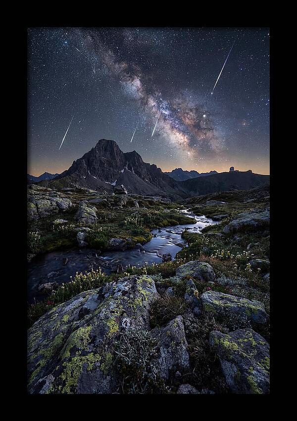 Meteor Shower Over Majestic Mountains