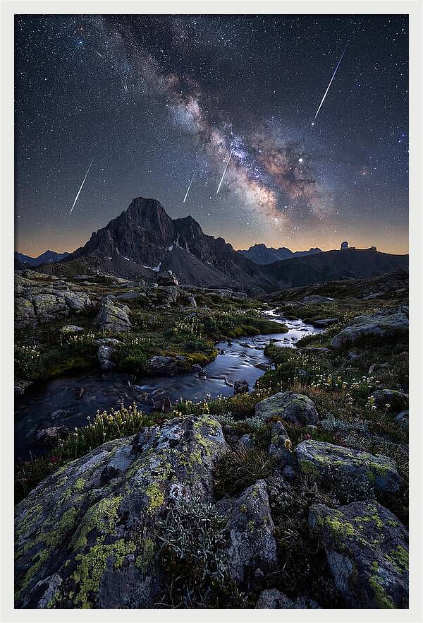 Meteor Shower Over Majestic Mountains