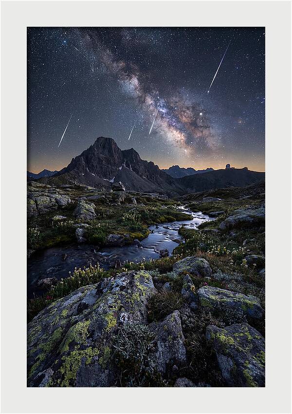 Meteor Shower Over Majestic Mountains