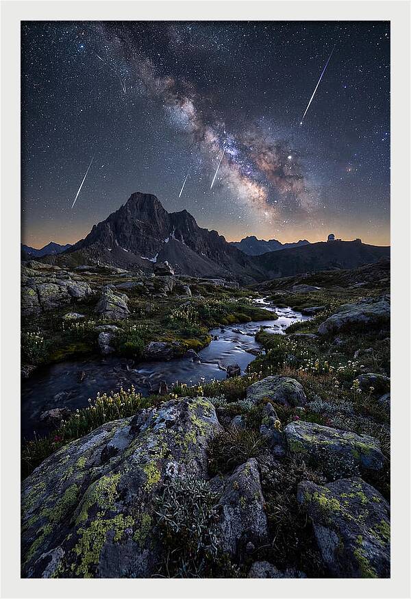 Meteor Shower Over Majestic Mountains