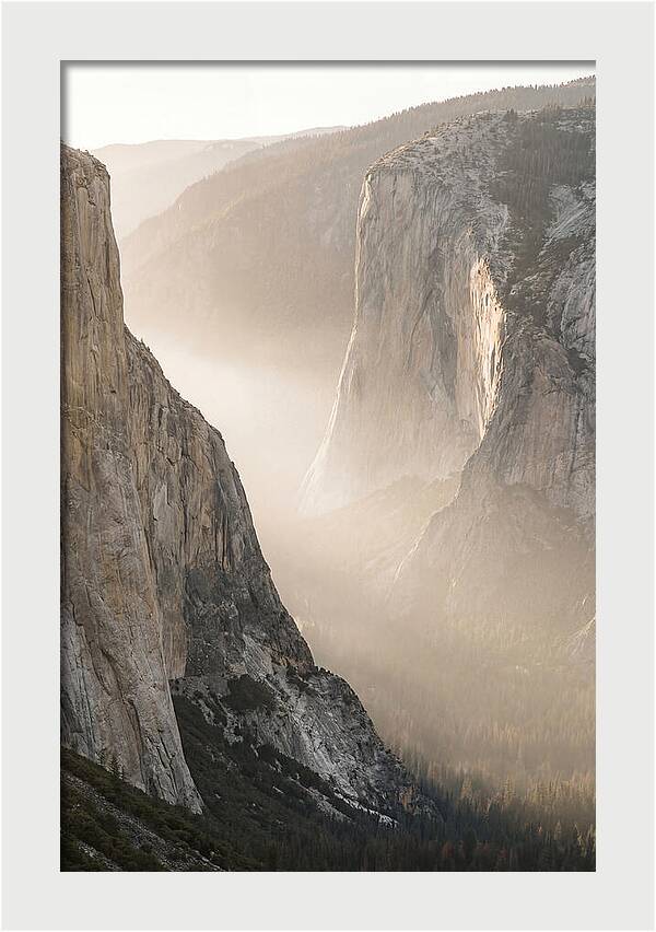 Misty Valley Between Towering Cliffs