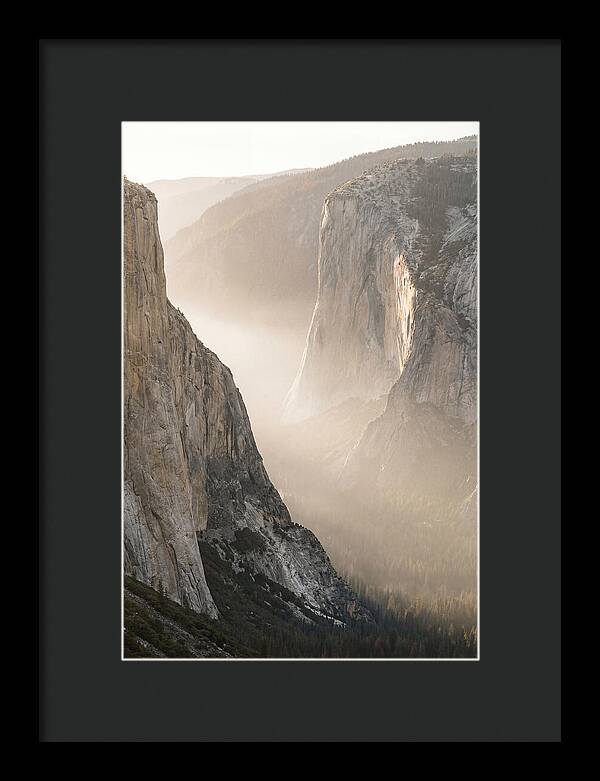 Misty Valley Between Towering Cliffs