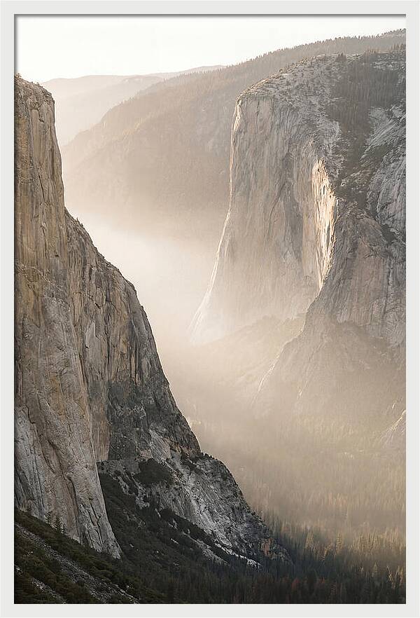 Misty Valley Between Towering Cliffs