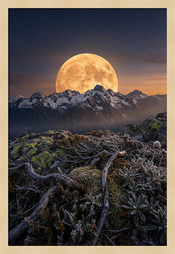 Moon Rising Over Majestic Peaks