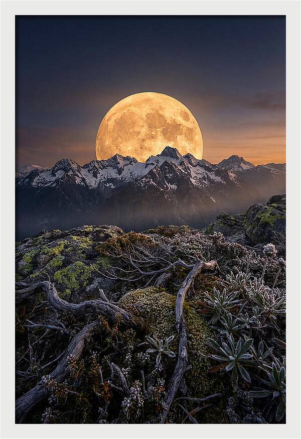 Moon Rising Over Majestic Peaks