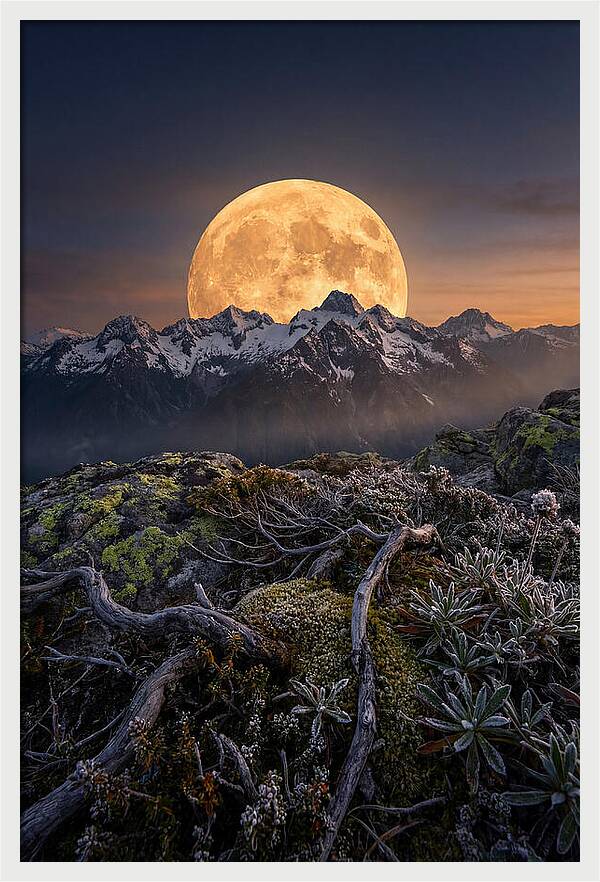 Moon Rising Over Majestic Peaks