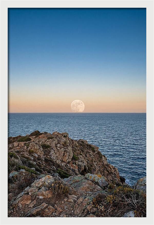 Moonrise Over Calm Sea