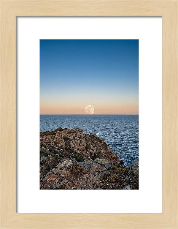Moonrise Over Calm Sea
