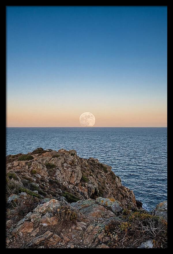 Moonrise Over Calm Sea