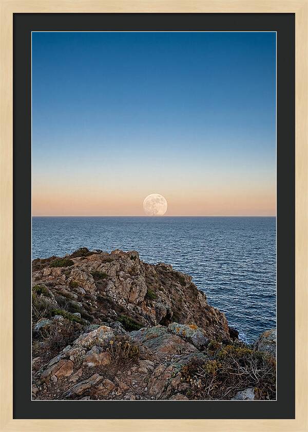 Moonrise Over Calm Sea