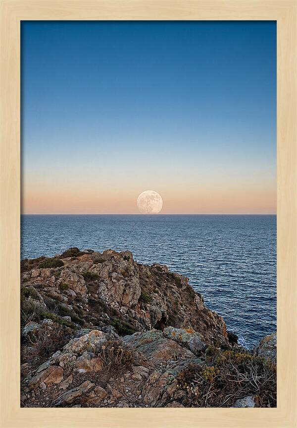 Moonrise Over Calm Sea
