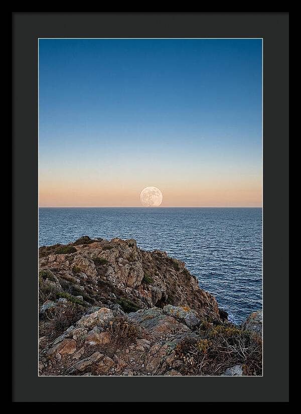 Moonrise Over Calm Sea