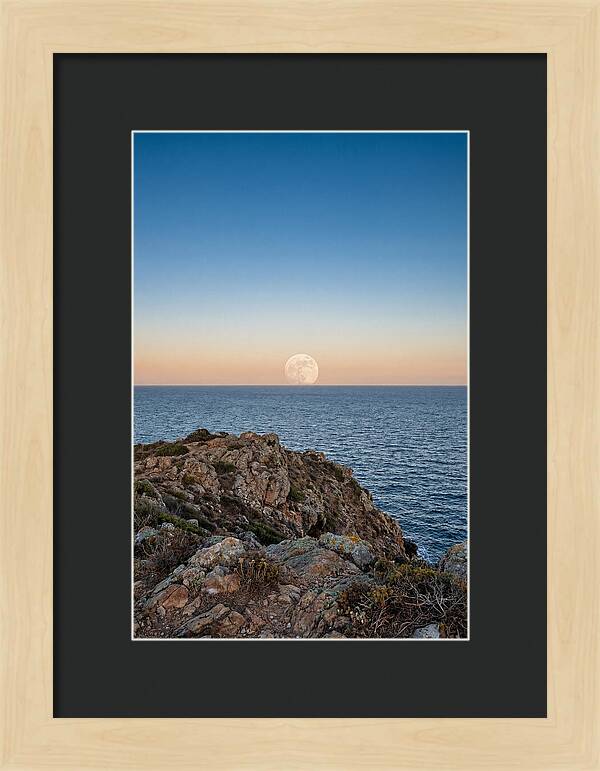 Moonrise Over Calm Sea