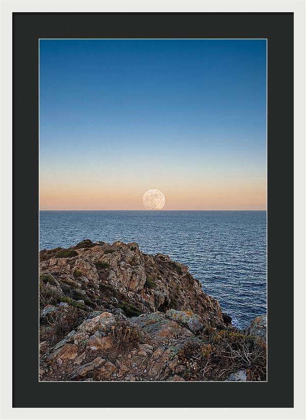 Moonrise Over Calm Sea