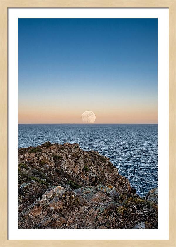 Moonrise Over Calm Sea