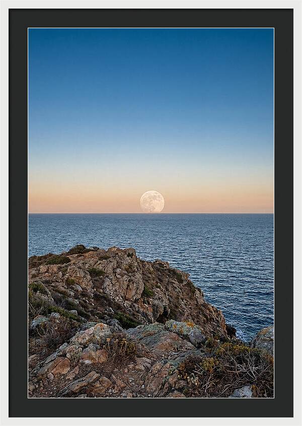 Moonrise Over Calm Sea