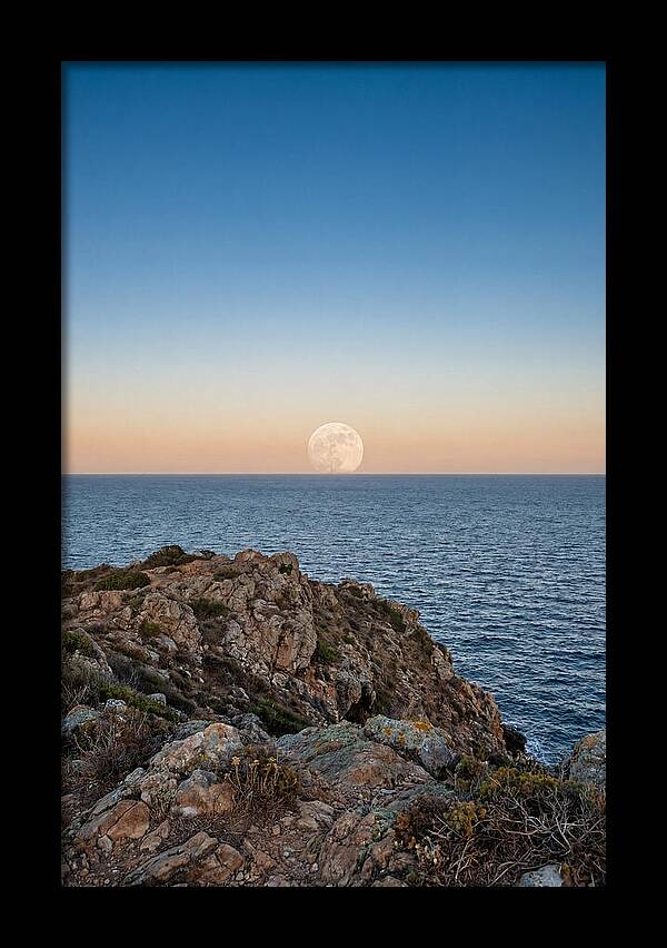 Moonrise Over Calm Sea