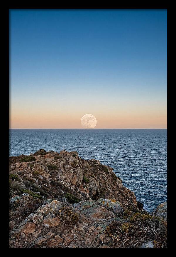 Moonrise Over Calm Sea
