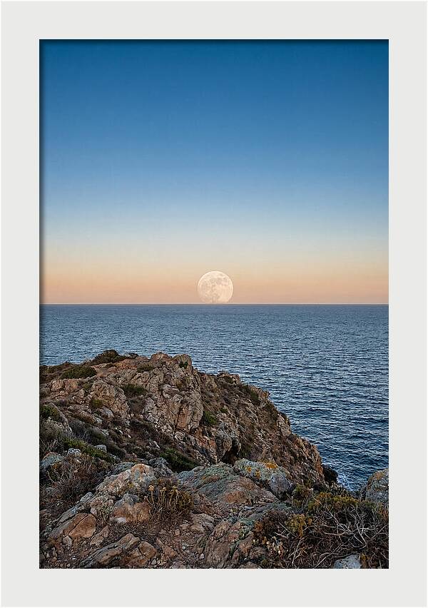 Moonrise Over Calm Sea