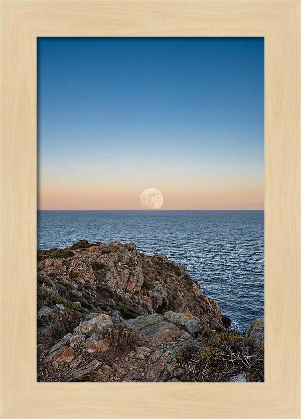 Moonrise Over Calm Sea