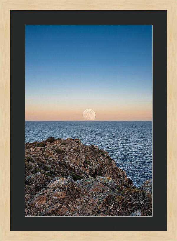 Moonrise Over Calm Sea