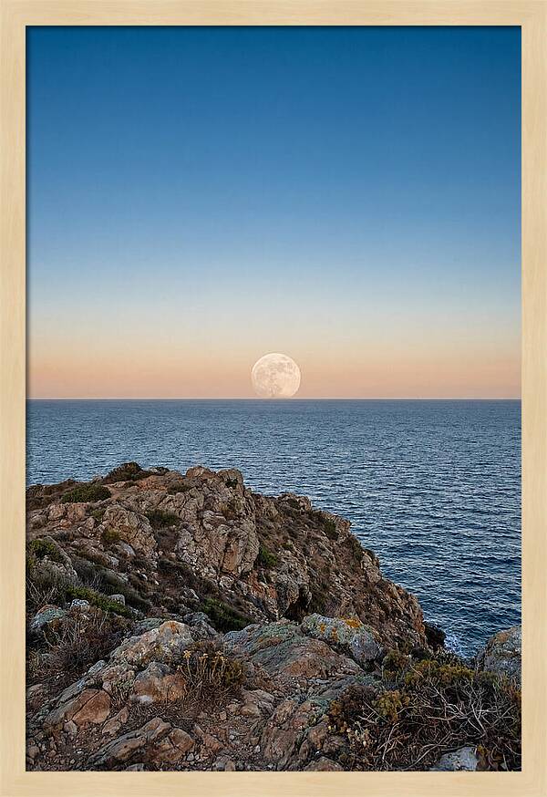 Moonrise Over Calm Sea
