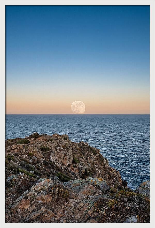 Moonrise Over Calm Sea
