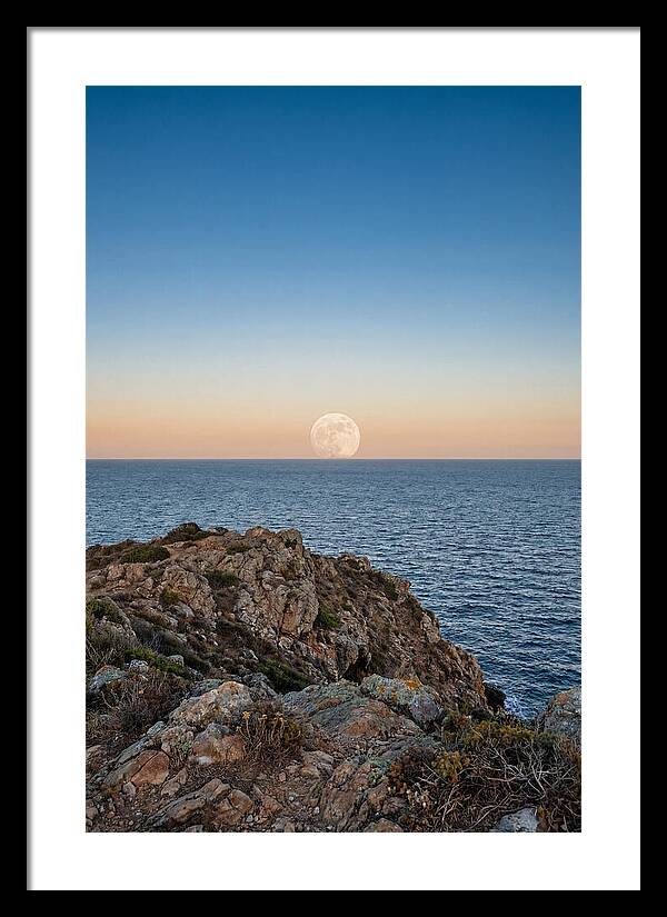 Moonrise Over Calm Sea