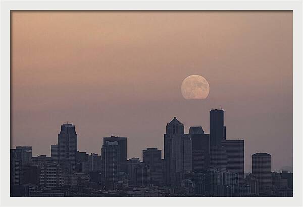 Moonrise Over City Skyline